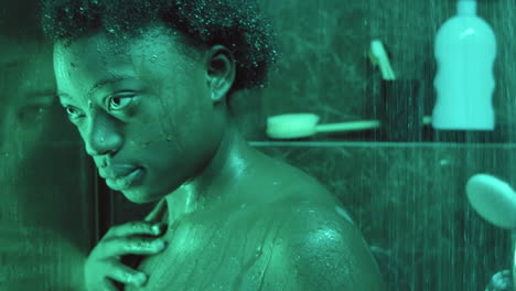 Pensive-African-American-Woman-in-Shower-Cabin